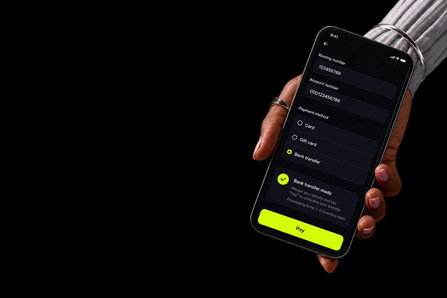 A phone in hand showing a bank-account checkout